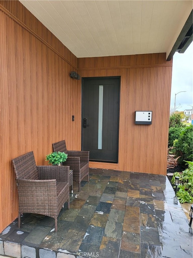 entrance to property featuring a patio