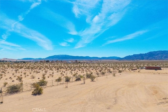 mountain view with a desert view and a rural view