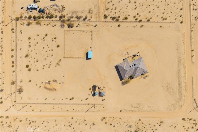 birds eye view of property featuring a desert view