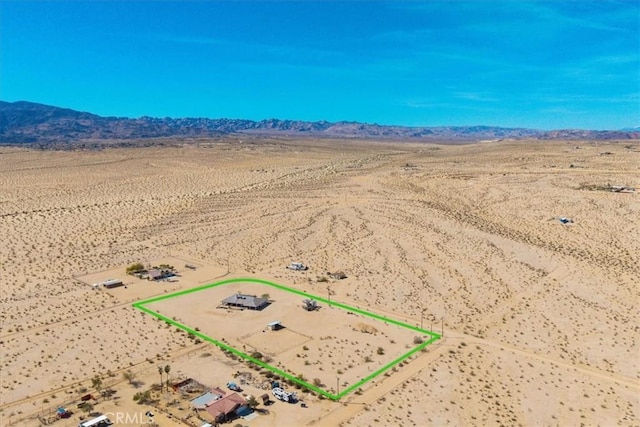 bird's eye view with view of desert, a rural view, and a mountain view