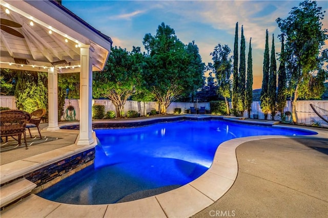 view of pool featuring a patio, a fenced backyard, and a fenced in pool