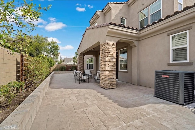 view of patio / terrace with a fenced backyard and cooling unit