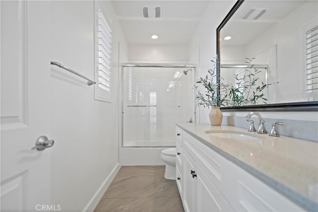 bathroom with toilet, shower / bath combination with glass door, visible vents, and vanity