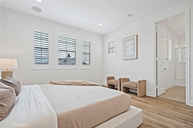 bedroom featuring light wood-style floors, recessed lighting, and baseboards