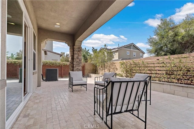 view of patio / terrace featuring an outdoor hangout area and a fenced backyard