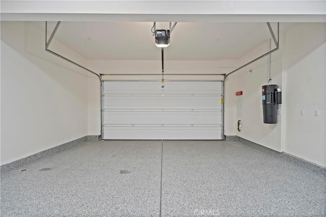 garage with baseboards and a garage door opener