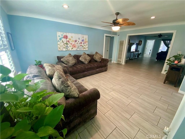living area featuring recessed lighting, a ceiling fan, and wood tiled floor