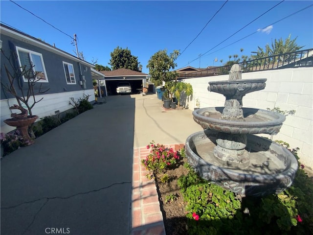 view of yard featuring an outdoor structure and fence