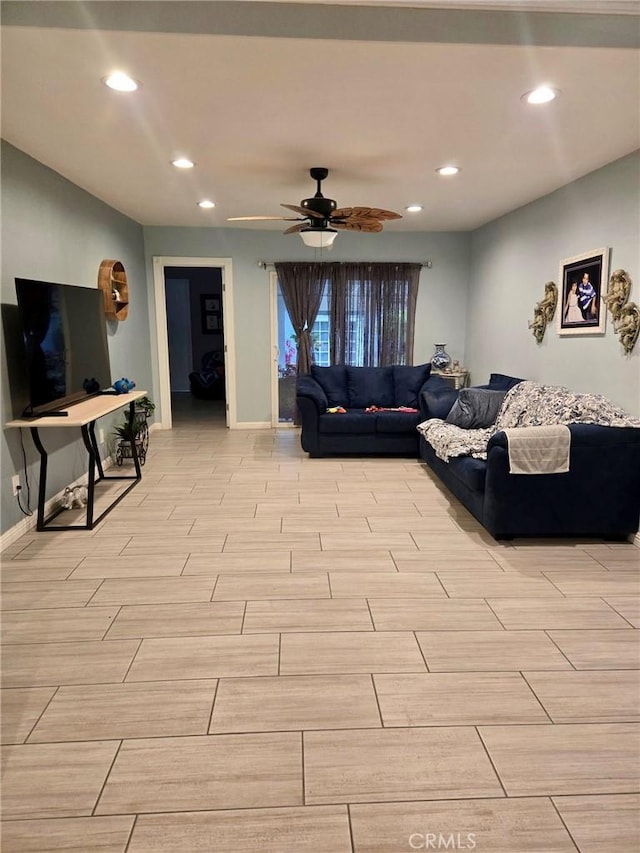 living room with wood finish floors, baseboards, recessed lighting, and a ceiling fan