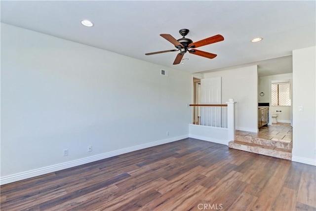 spare room featuring recessed lighting, visible vents, ceiling fan, wood finished floors, and baseboards