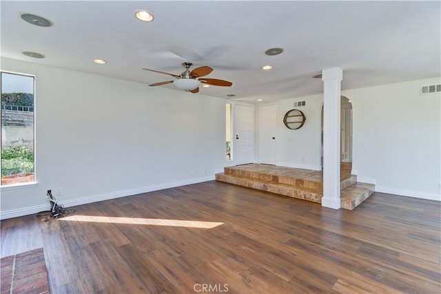 unfurnished room with baseboards, wood finished floors, visible vents, and recessed lighting