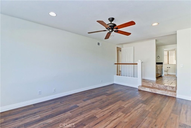 spare room featuring visible vents, baseboards, ceiling fan, wood finished floors, and recessed lighting