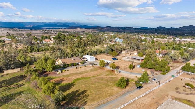 drone / aerial view featuring a mountain view