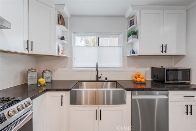 kitchen with stainless steel appliances, white cabinets, a sink, and open shelves