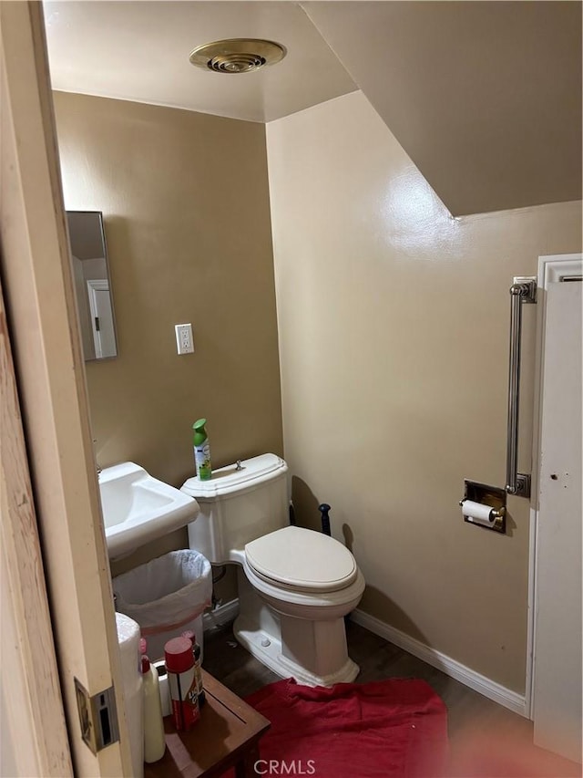 667 Canyon Crest Dr, Sierra Madre, CA 91024 - half bathroom featuring toilet and baseboards
