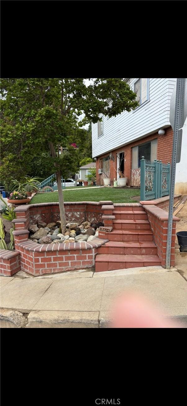 667 Canyon Crest Dr, Sierra Madre, CA 91024 - view of front of home featuring brick siding