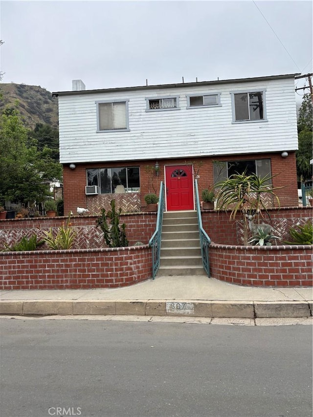 667 Canyon Crest Dr, Sierra Madre, CA 91024 - view of front facade with entry steps and brick siding