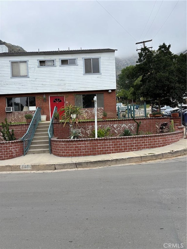 667 Canyon Crest Dr, Sierra Madre, CA 91024 - view of front of home with brick siding and stairs