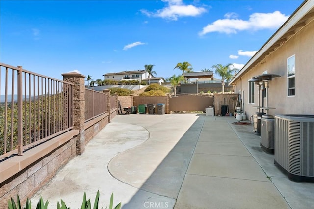 view of patio / terrace featuring a fenced backyard and central AC