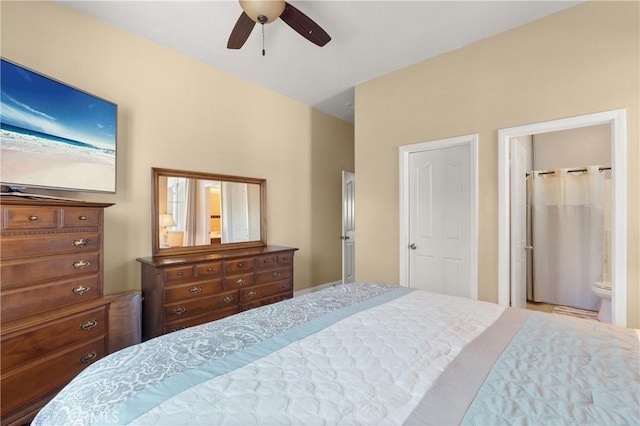 bedroom featuring ceiling fan and ensuite bath