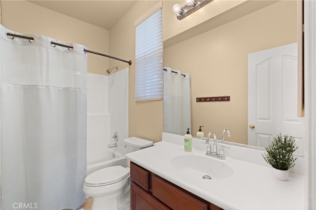 full bathroom with shower / bath combination with curtain, vanity, and toilet