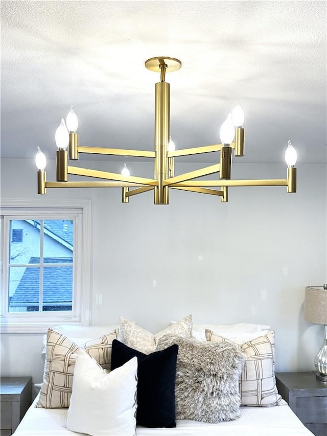 interior space featuring a textured ceiling and an inviting chandelier
