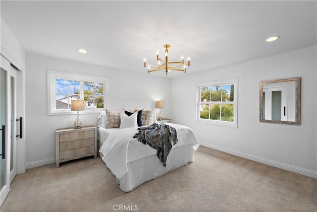bedroom with light colored carpet, an inviting chandelier, baseboards, and recessed lighting