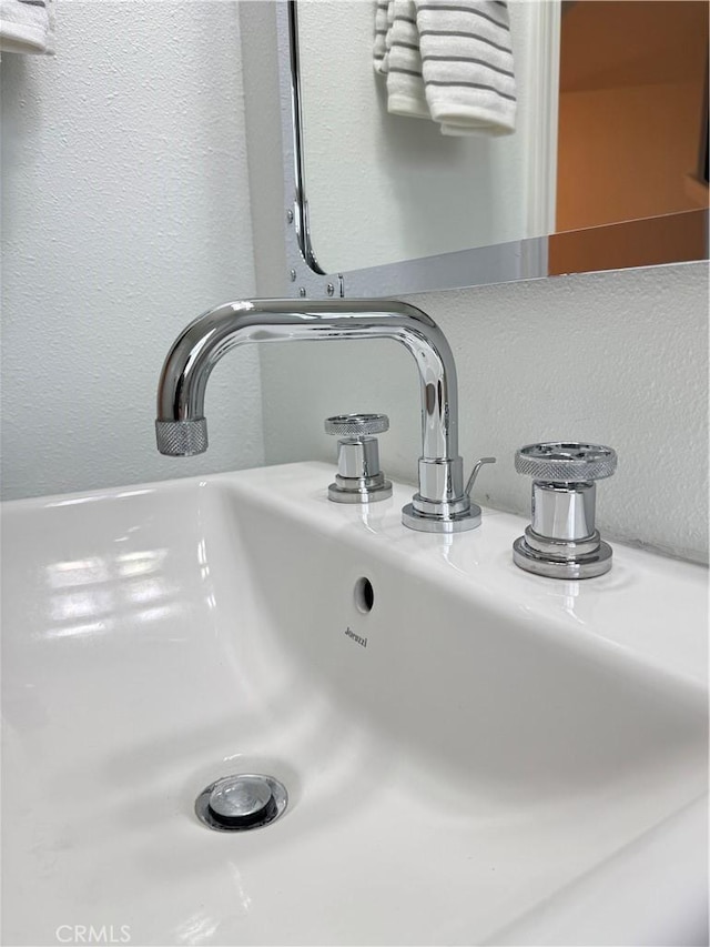 room details with a sink and a textured wall