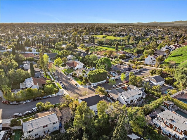 drone / aerial view featuring a residential view and a mountain view