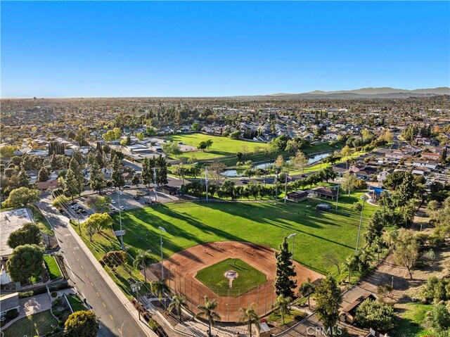 drone / aerial view with a water and mountain view and a residential view