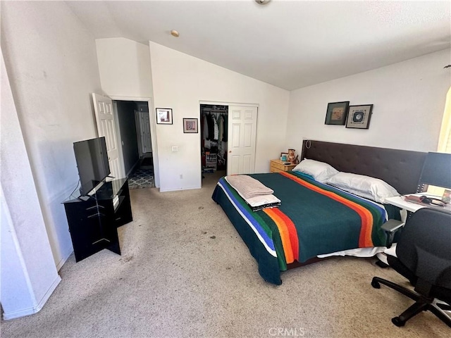 carpeted bedroom with vaulted ceiling, a closet, and baseboards