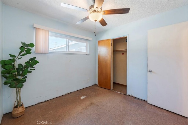 unfurnished bedroom featuring a closet, ceiling fan, and a textured ceiling