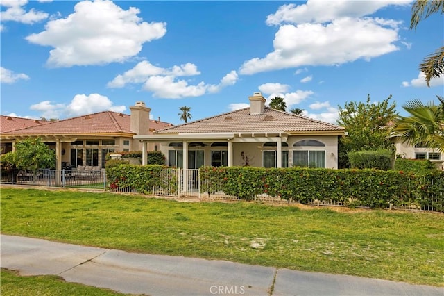 82745 Odlum Dr, Indio, CA 92201 - back of house with a tiled roof, stucco siding, and a chimney