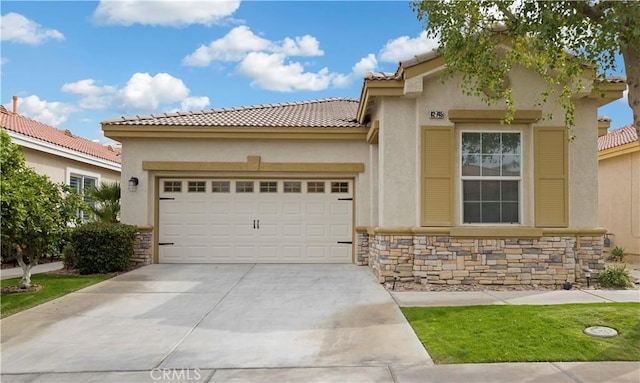 82745 Odlum Dr, Indio, CA 92201 - view of front of house with stone siding, a garage, stucco siding, and concrete driveway