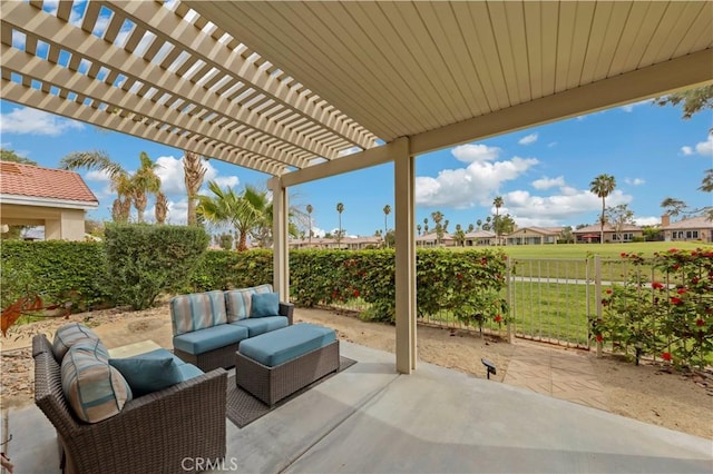 82745 Odlum Dr, Indio, CA 92201 - fenced backyard featuring an outdoor living space, a patio area, and a pergola
