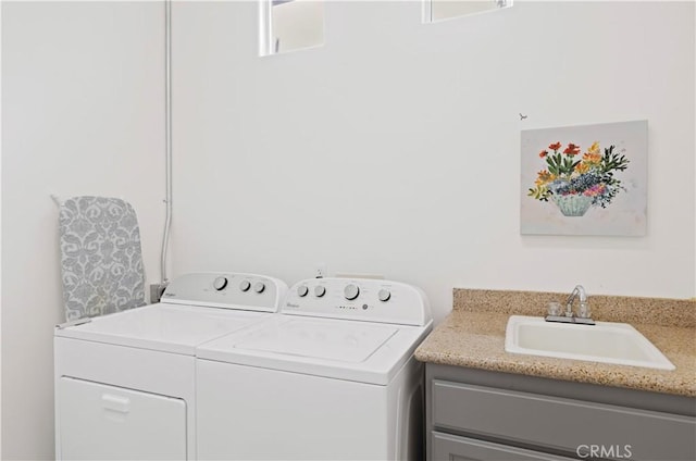82745 Odlum Dr, Indio, CA 92201 - laundry area featuring washing machine and dryer and cabinet space