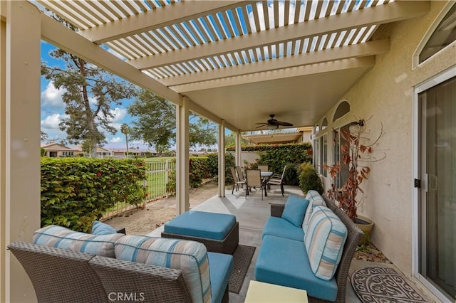 82745 Odlum Dr, Indio, CA 92201 - fenced backyard with an outdoor living space, outdoor dining area, a patio area, and a ceiling fan