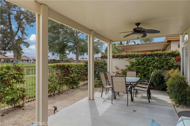 82745 Odlum Dr, Indio, CA 92201 - fenced backyard with a patio area, ceiling fan, and outdoor dining area