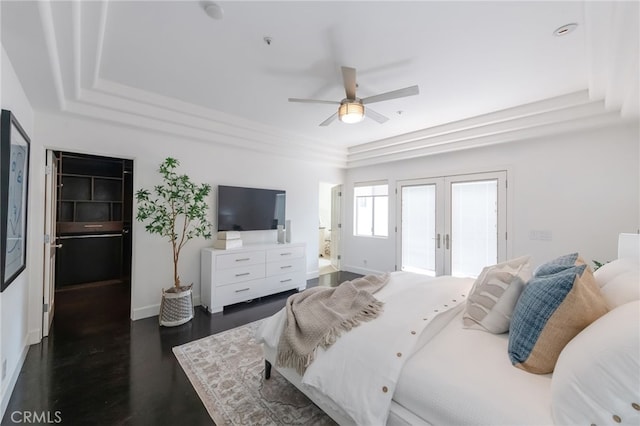 bedroom featuring access to exterior, baseboards, french doors, a ceiling fan, and dark wood-style flooring