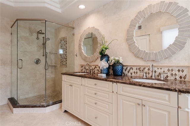 full bath with a sink, visible vents, and a stall shower