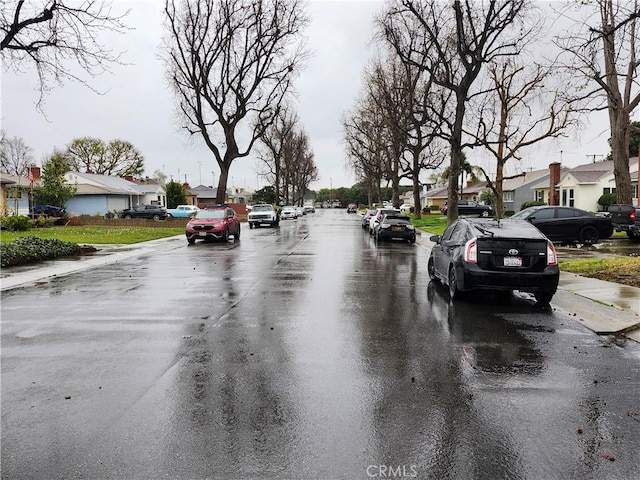 view of road featuring sidewalks and a residential view