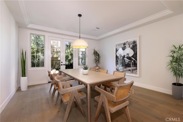 dining room with baseboards, french doors, light wood finished floors, and crown molding