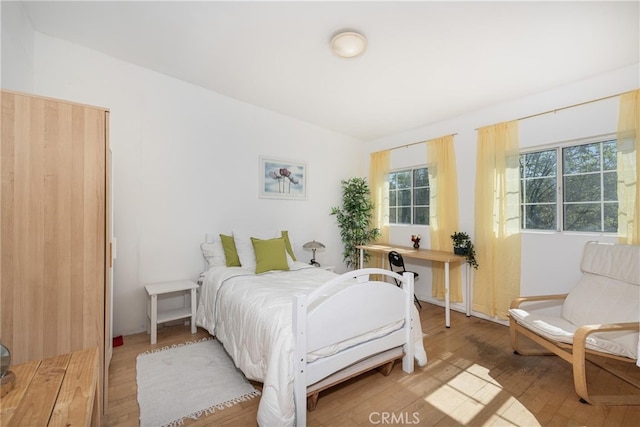 bedroom featuring light wood finished floors