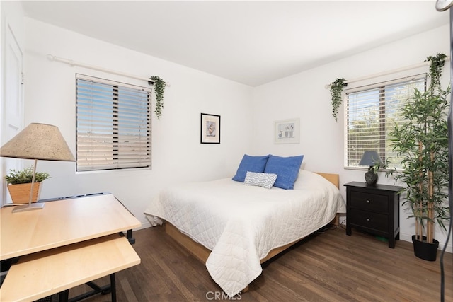 bedroom with wood finished floors