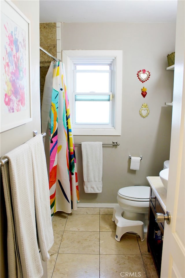 bathroom with a shower with curtain, toilet, vanity, and tile patterned flooring