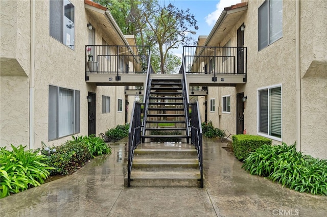 view of exterior entry featuring stucco siding