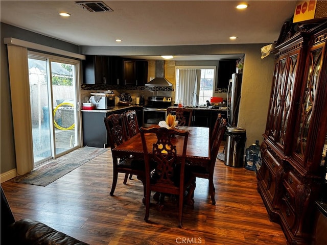 dining area with recessed lighting, plenty of natural light, visible vents, and dark wood-style flooring