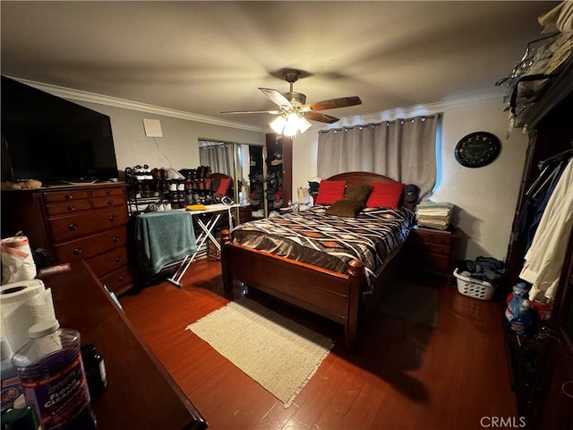 bedroom featuring a ceiling fan, crown molding, and wood finished floors