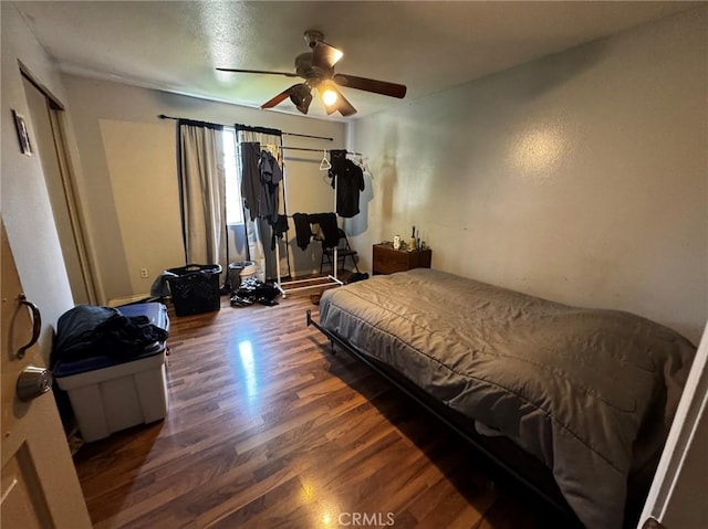 bedroom with ceiling fan and wood finished floors