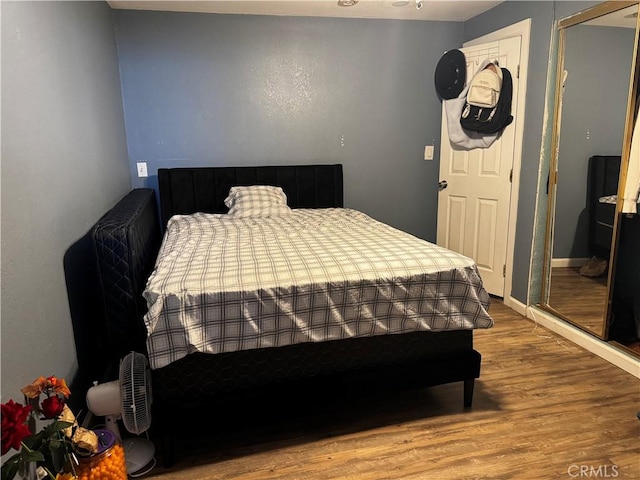 bedroom with wood finished floors